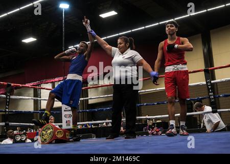 Lubbock, TX, USA. 9th Dec, 2022. Thomas Covington (blue) of Detroit, MI is declared the winner of his bout with Ranulfo Bocanegra of Donna, TX and the national champion of the Youth Male 119lb division. (Credit Image: © Adam DelGiudice/ZUMA Press Wire) Credit: ZUMA Press, Inc./Alamy Live News Stock Photo