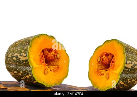large pumpkin cut in half on a white background Stock Photo