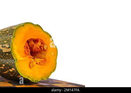 large pumpkin cut in half on a white background Stock Photo