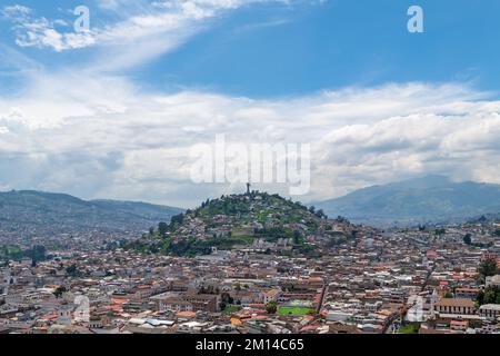 Aerial cityscape of Quito historic city center with Panecillo Hill and Virgin of Quito statue, Pichincha, Ecuador. Stock Photo