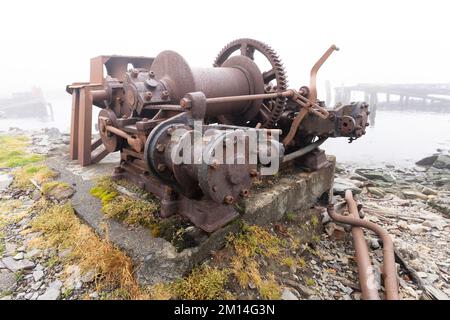 Old, rusty whale oil tanks and processing facilities at a now abandoned whaling station in Grytviken -on the island of South Georgia. Stock Photo