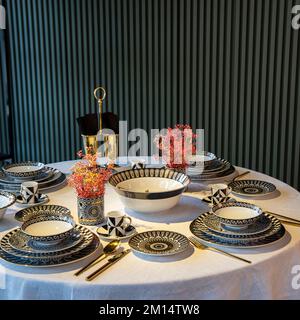 oriental designed luxury dinner plates on the table Stock Photo