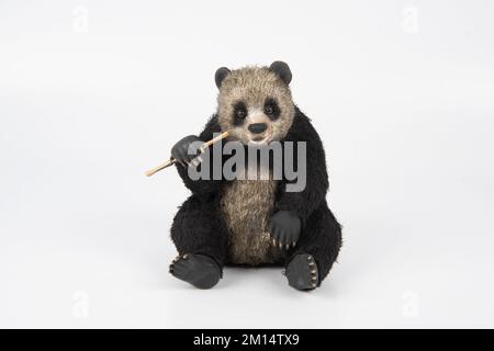 hand made panda figure with metal wire isolated on white Stock Photo