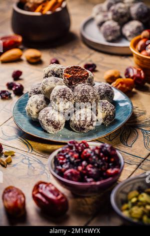 Energy vegan balls - raw dessert (bliss balls),  sugar free candies with ingredients, nut and fruits Stock Photo