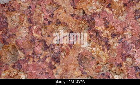 The texture of the stone is red orange, brick, background material Stock Photo