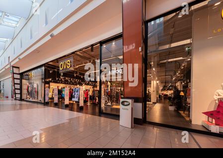 Mondovì, Cuneo, Italy - December 07, 2022: OVS (Oviesse) large clothing store in Mondovicino Italian outlet shopping mall. OVS is famous Italian cloth Stock Photo