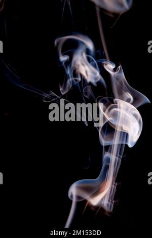 Wisp of smoke on black background. Stock Photo
