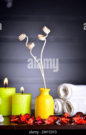 reed diffuser with candle and towel Stock Photo