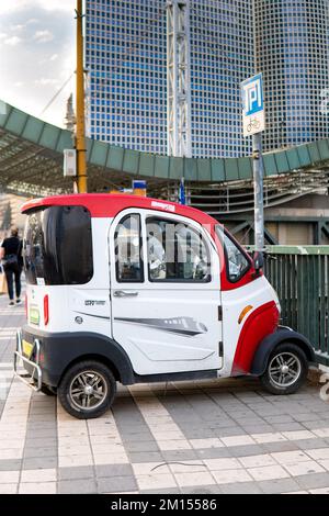 Tel Aviv Yafo, Israel - October 26,2022. Funny small car parking on a sidewalk in Tel-Aviv Stock Photo