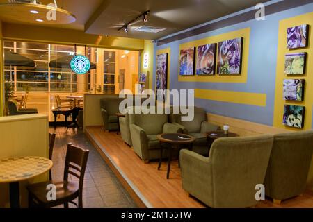 KUCHING - MAY 02: airport cafe interior on May 02, 2014 in Kuching, Malaysia. Starbucks is the largest coffeehouse company in the world, with 23,187 s Stock Photo