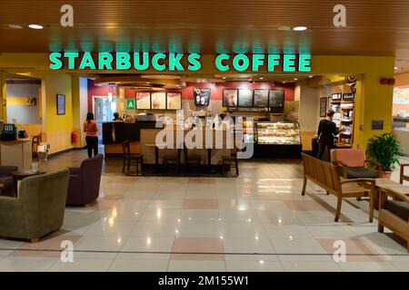 KUCHING - MAY 02: airport cafe interior on May 02, 2014 in Kuching, Malaysia. Starbucks is the largest coffeehouse company in the world, with 23,187 s Stock Photo