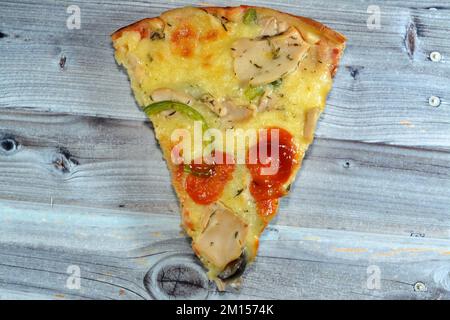 Chicken barbecue pizza with toppings of pieces of chicken, salami, peppers, mozzarella, barbecue sauce, Italian and American cuisine background, fast Stock Photo