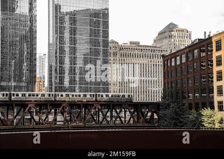 A lake street train in Chicago with cityscape background on a gloomy day Stock Photo