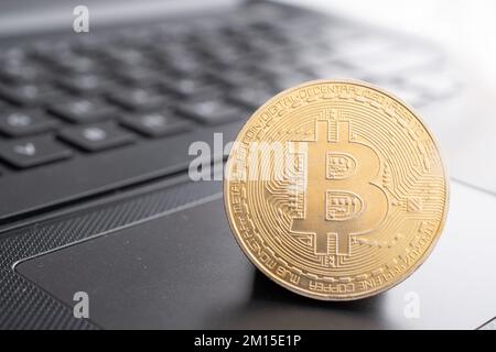 Closeup of bitcoin on computer table Stock Photo