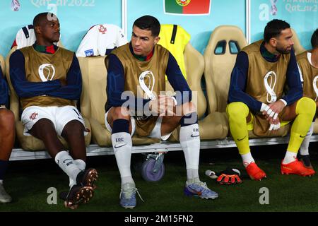 Doha, Qatar. 10th Dec, 2022. Soccer, World Cup, Morocco - Portugal, final round, quarterfinal, Al-Thumama Stadium, Portugal's Cristiano Ronaldo sits on the bench as the match begins. Credit: Tom Weller/dpa/Alamy Live News Stock Photo