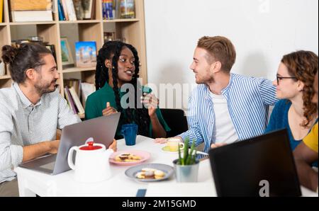 Group of multiracial students studing together for university exam. Portrait of young business people in smart casual wear Stock Photo