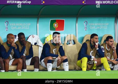 Doha, Qatar. 10th Dec, 2022. Soccer, World Cup, Morocco - Portugal, final round, quarterfinal, Al-Thumama Stadium, Portugal's Cristiano Ronaldo sits on the bench as the match begins. Credit: Tom Weller/dpa/Alamy Live News Stock Photo