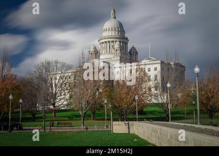 Clouds drag high above the capitol building on a late autumn day in Providence, RI Stock Photo
