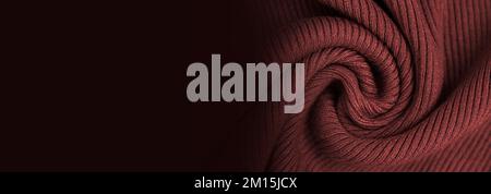 Knitted dark red or maroon color textured fabric background. Warm scarf, sweater or blanket banner Stock Photo
