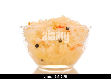 Sauerkraut in a glass plate, macro, isolated on a white background. Stock Photo