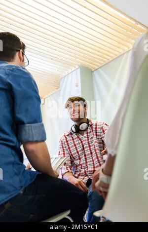 Two creative men working at office in casual clothes Stock Photo