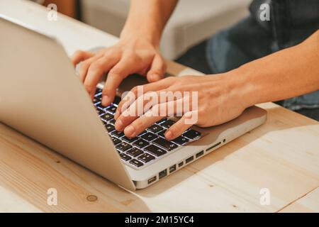 Anonymous man typing on a Modern Laptop Stock Photo