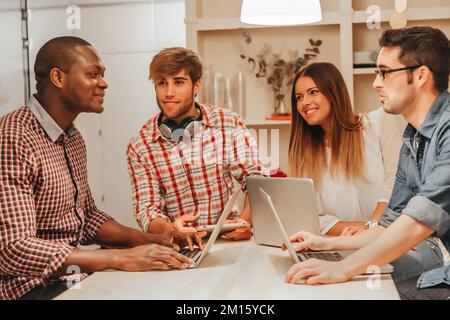 Multi-ethnic young entrepreneurs working at the Office Stock Photo