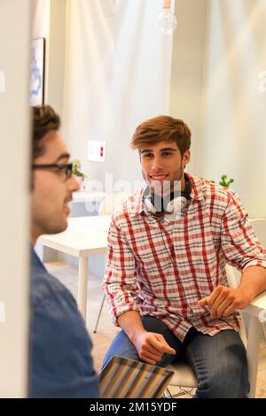 Two creative entrepreneurs working at office in casual clothes Stock Photo