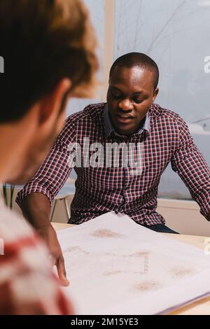 Two architects and engineers working at the Office Stock Photo