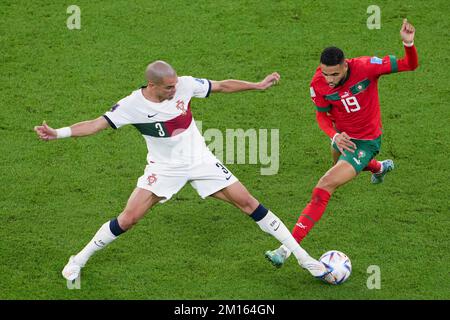 Doha, Qatar. 10th Dec, 2022. Pepe (L) of Portugal vies with Youssef En-Nesyri of Morocco during their Quarterfinal of the 2022 FIFA World Cup at Al Thumama Stadium in Doha, Qatar, Dec. 10, 2022. Credit: Zheng Huansong/Xinhua/Alamy Live News Stock Photo
