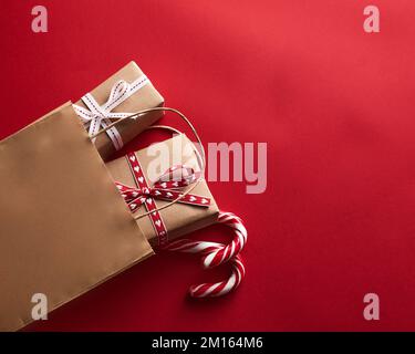 shopping bag with gift box and christmas decoration. Buying gifts for Christmas Stock Photo