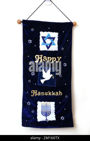 Blue Velvet Happy Hanukkah Banner with detail of  Star of David, Dove of Peace and Menorah Stock Photo