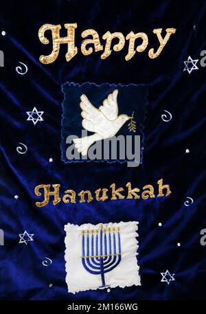Blue Velvet Happy Hanukkah Banner Showing Dove of Peace and Menorah Stock Photo
