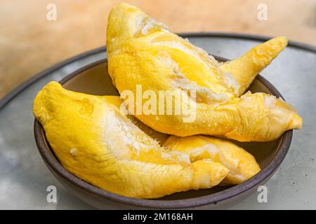 Durian is famous tropical fruit. It is native in South East Asian countries. It has distinct or strong smells that some people may feel disgusting, smelly Stock Photo