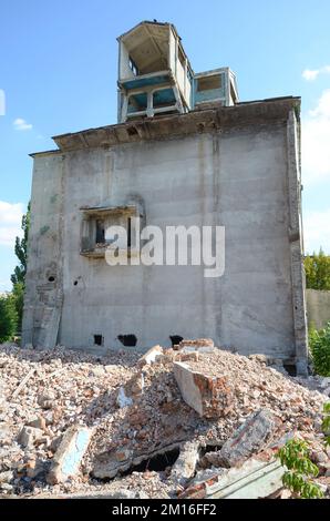 Collapsed industrial multistorey building in daytime. Disaster scene ...