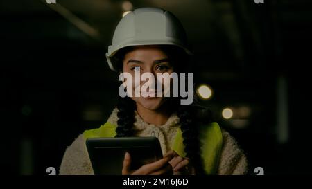 Professional engineer architect technical supervisor boss builder wearing hardhat stand on underground construction site female inspector woman Stock Photo