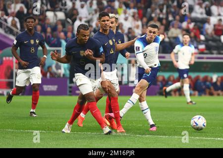 Al Khor, Qatar. 10th Dec, 2022. Phil Foden (R) of England in action with Jules Kounde of France during the 2022 FIFA World Cup Quarter-Final match at Al Bayt Stadium in Al Khor, Qatar on December 10, 2022. Photo by Chris Brunskill/UPI Credit: UPI/Alamy Live News Stock Photo