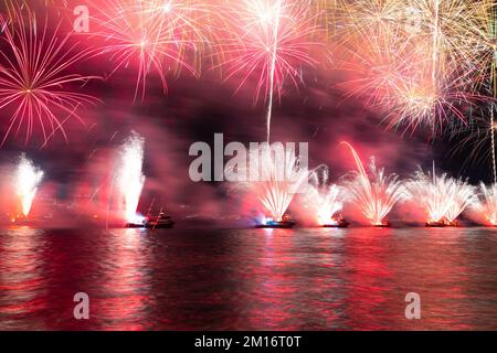 Fireworks show on the sea. Celebration background photo. New year celebration fireworks show. Stock Photo
