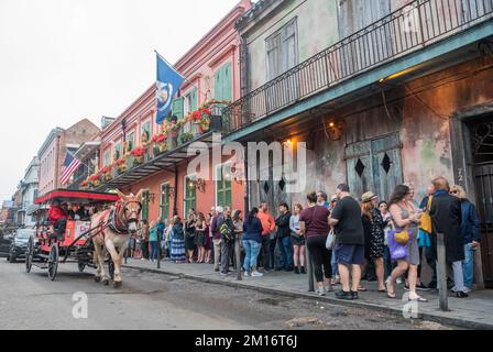 New Orleans, United States of America – December 4, 2022. View of St Peter street in New Orleans, with people queuing in front of the Preservation Hal Stock Photo