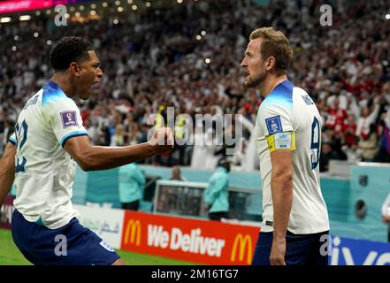 England's Harry Kane (right) celebrates with Jude Bellingham after scoring their side's first goal of the game from the penalty spot during the FIFA World Cup Quarter-Final match at the Al Bayt Stadium in Al Khor, Qatar. Picture date: Saturday December 10, 2022. Stock Photo