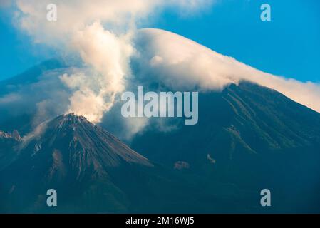 The Santiaguito and Santa Maria volcanoes covered in cloud Stock Photo