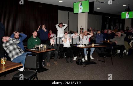 England fans react after watching Harry Kane missed a penalty at the 76 Lounge at the Lamex Stadium, Stevenage, during a screening of the FIFA World Cup Quarter-Final match between England and France. Picture date: Saturday December 10, 2022. Stock Photo