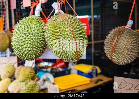 Durian fruit in fruit market in Asia. The durian is the edible fruit of several tree species belonging to the genus Durio Stock Photo