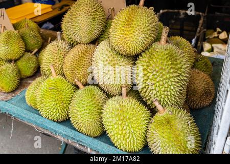 Durian fruit in fruit market in Asia. The durian is the edible fruit of several tree species belonging to the genus Durio Stock Photo