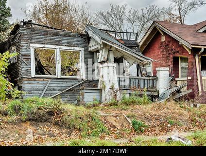 The ruins of a home in a Detroit neighborhood show a collapsed roof through the front windows Stock Photo