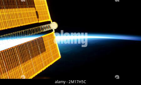 Solar arrays from the International space station floating above earth in outer space. Digitally enhanced. Elements of this image furnished by NASA Stock Photo