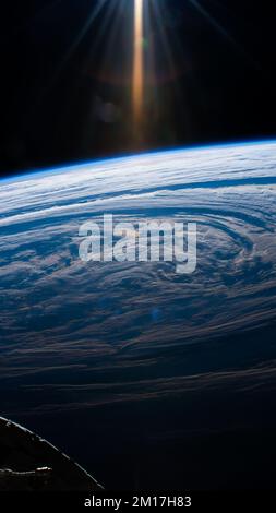Aerial view of clouds forming on earth's sky as seen from outer space. Digitally enhanced. Elements of this image furnished by NASA. Stock Photo