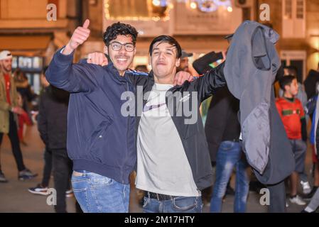 the moroccan people celebrate their victory in the world cup all over spain, in the picture a crowd of people celebrating in the main square of lugo t Stock Photo