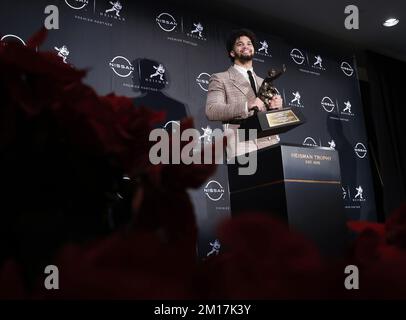 New York, United States. 10th Dec, 2022. USC Trojans quarterback Caleb Williams holds the Heisman Trophy at the Marriott Marquis after he wins the award in New York City on Saturday, December 10, 2022. Photo by John Angelillo/UPI Credit: UPI/Alamy Live News Stock Photo