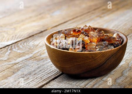 caramelized sugar in wooden bowl on table Stock Photo